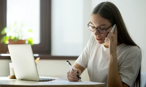 female worker consulting client over phone 1